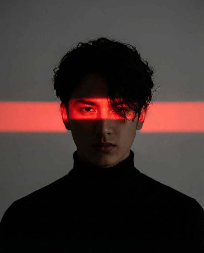 Cinematic Neon Light Strip Studio Portrait — Cinematic studio portrait of a young man with messy textured hair, wearing a black turtleneck, centered composition
