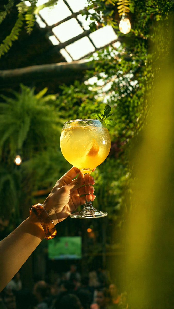 gpt2-social-media-post-golden-cocktail-in-greenhouse-bar AI image template preview