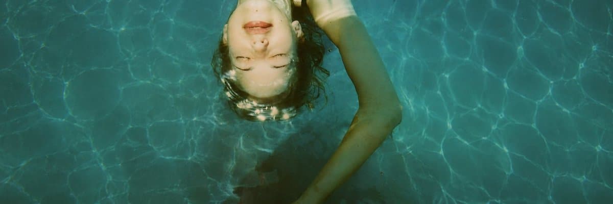 Anonymized Swimmer in Teal Pool - AI image template preview