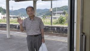 Elderly Man Waving at Rural Station preview