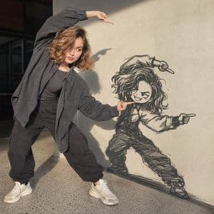 Woman Interacting with Wall Doodle preview